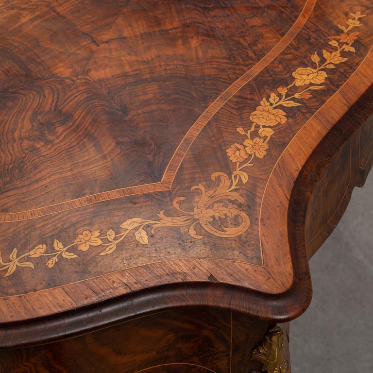 a rococo-style table/desk from England in the late 19th century.