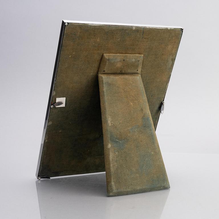 A silver and enamel frame with glass, mark of CG Hallberg, Stockholm 1935.