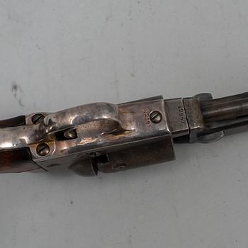 A Colt 1849 pocket percussion revolver with serial no 92569.