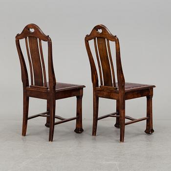 A late 19th century dining table with ten chairs and five extension leaves.