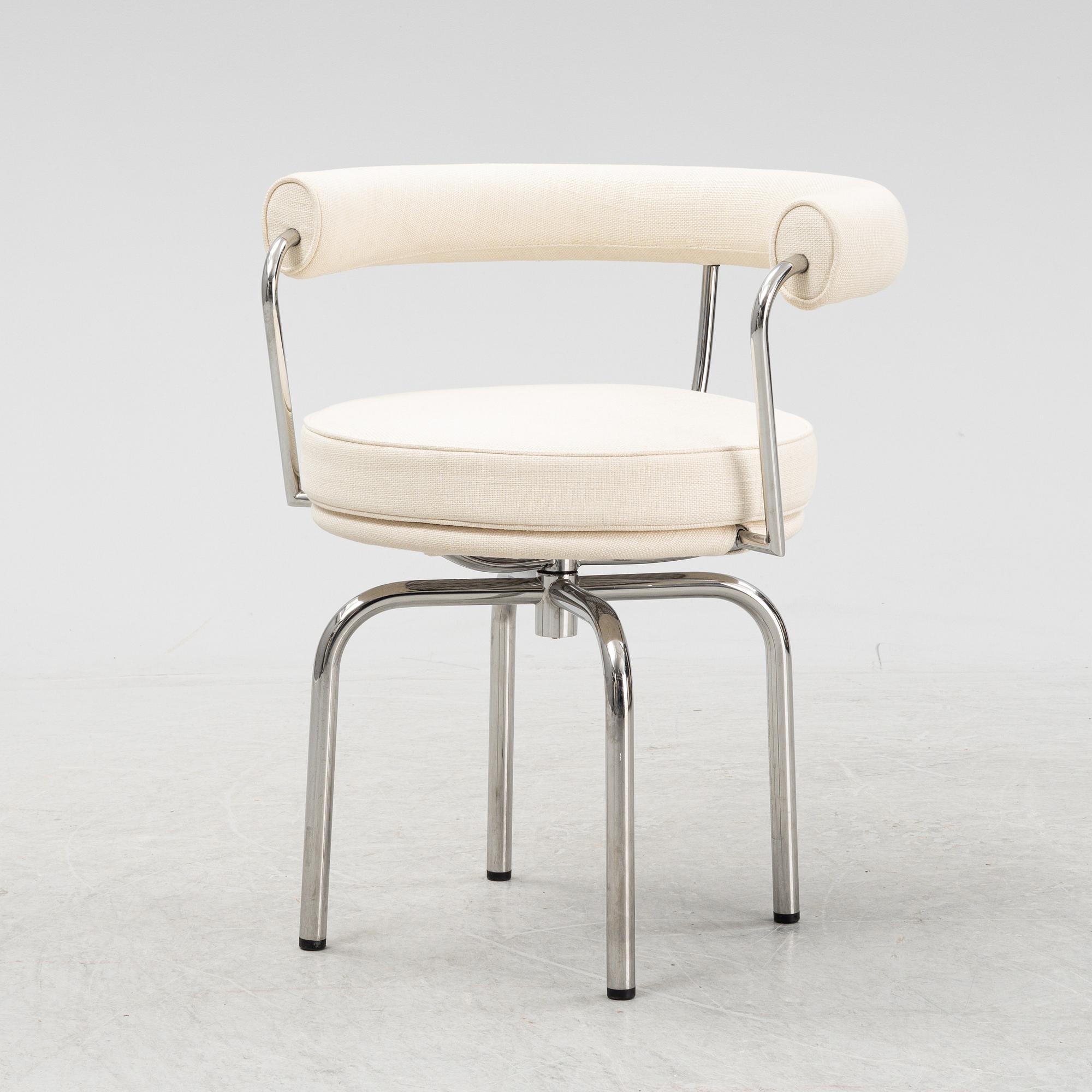 A LC 7 swivel chair by Charlotte Perriand & Pierre Jeanneret & Le Corbusier for Cassina, designed in 1927.