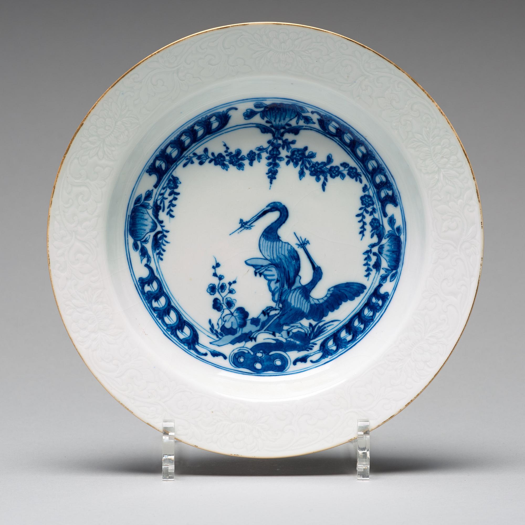 A set of eight blue and white armorial soup dishes, Qing dynasty, 18th Century.