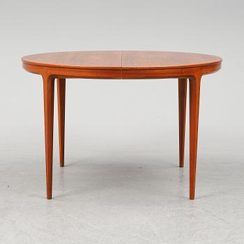 BERTIL FRIDHAGEN, a seven  piece walnut dining suite from Bodafors.