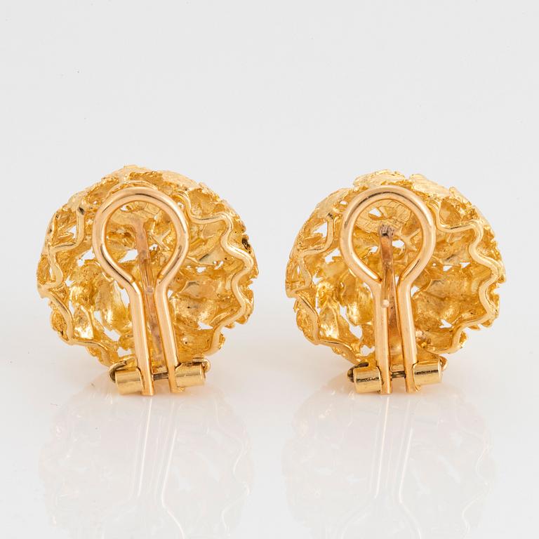 A pair of 18K gold earrings.