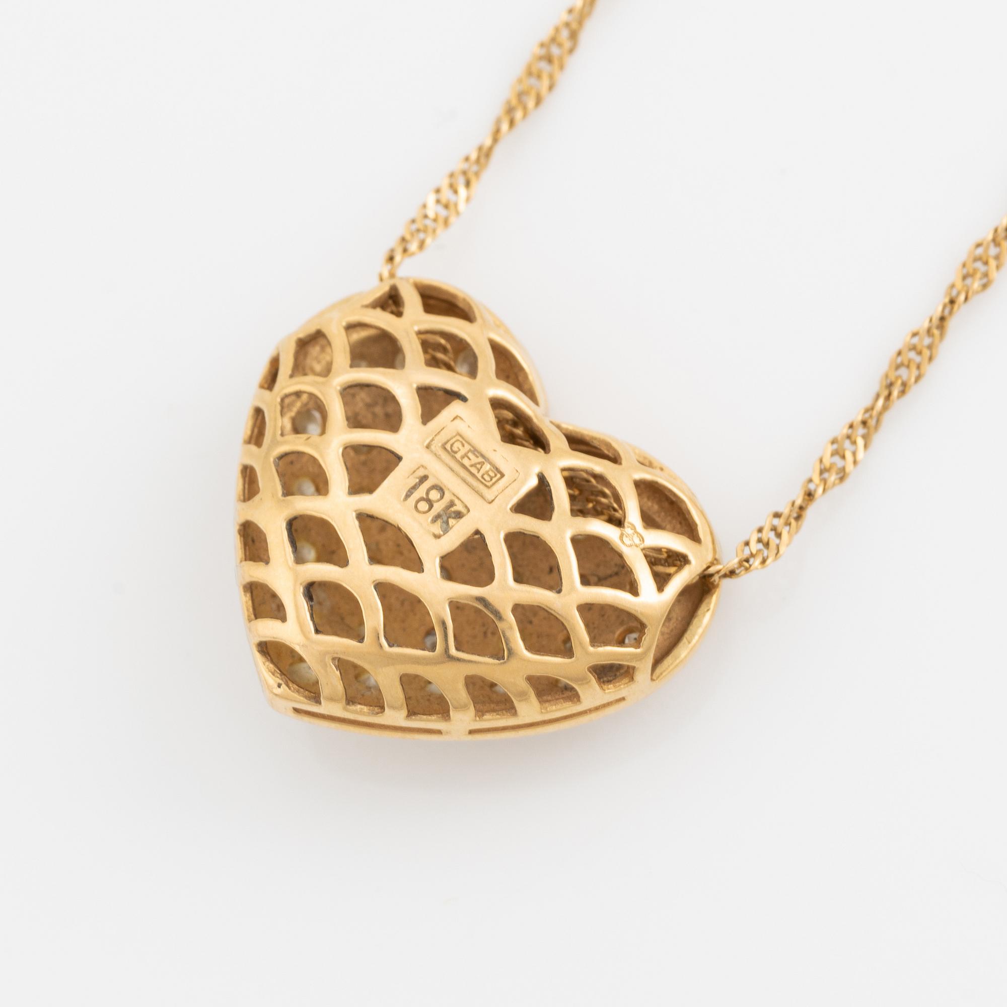 Heart shaped diamond necklace, 18K gold and diamonds.