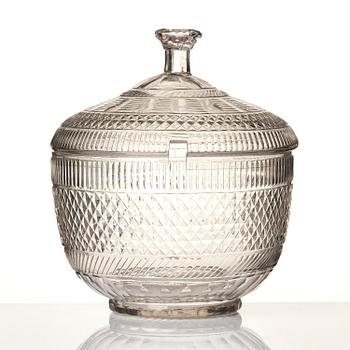 A cut glass punch bowl with cover, stand and ladle, Empire, first part of the 19th century.