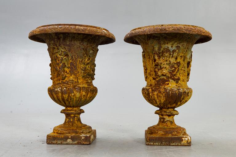 A pair of cast iron garden urns fist half of the 20th century.