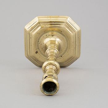 An 18th century bronze candlestick.