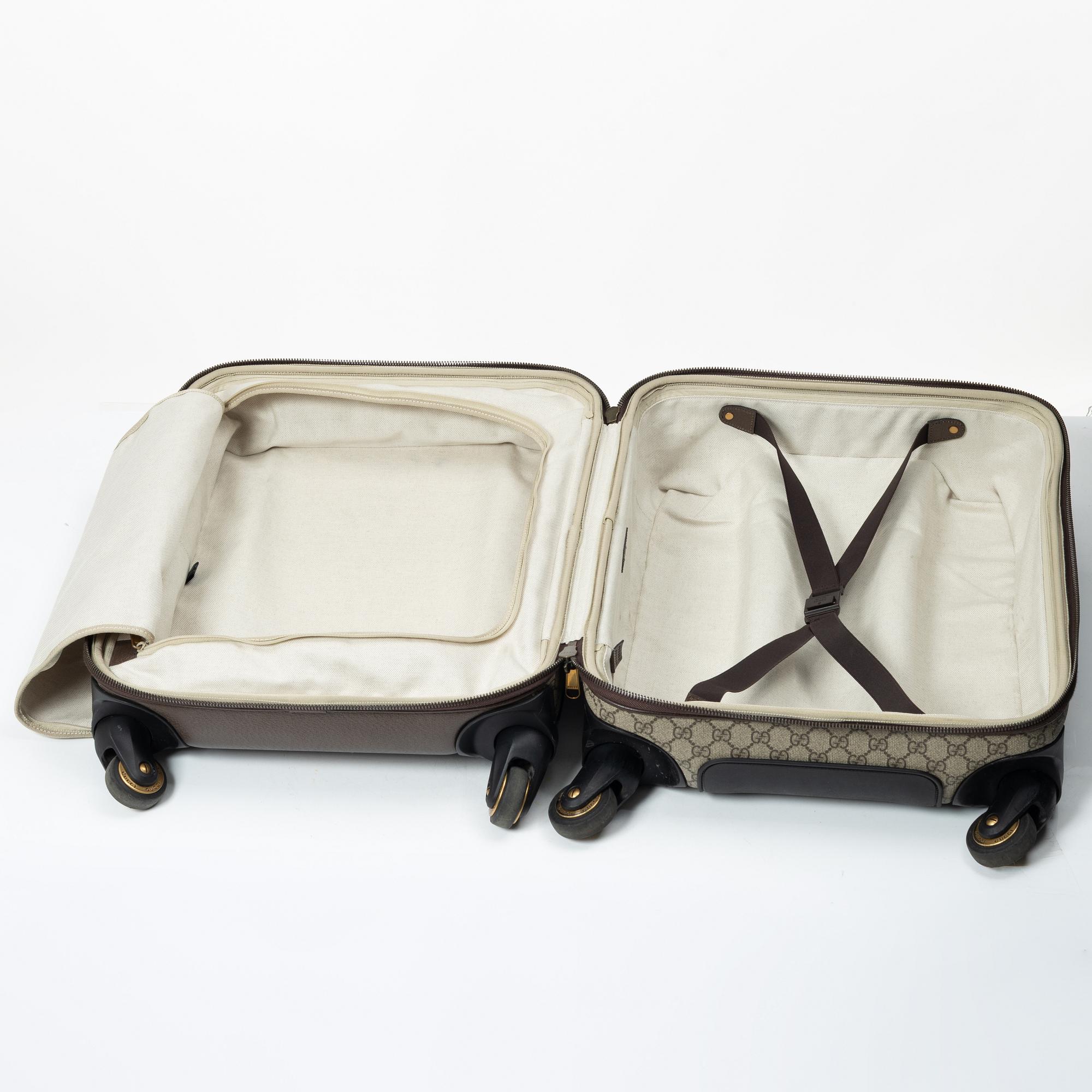 Gucci, suitcase / cabin bag.