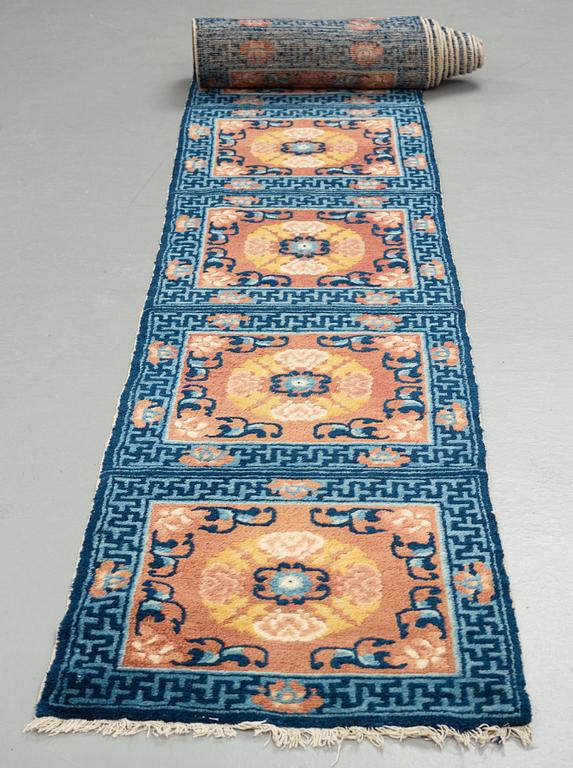 A MEDITATION CARPET, fourteen squares, an antique Ningxia, China late Qing, ca 822 x 60 cm.