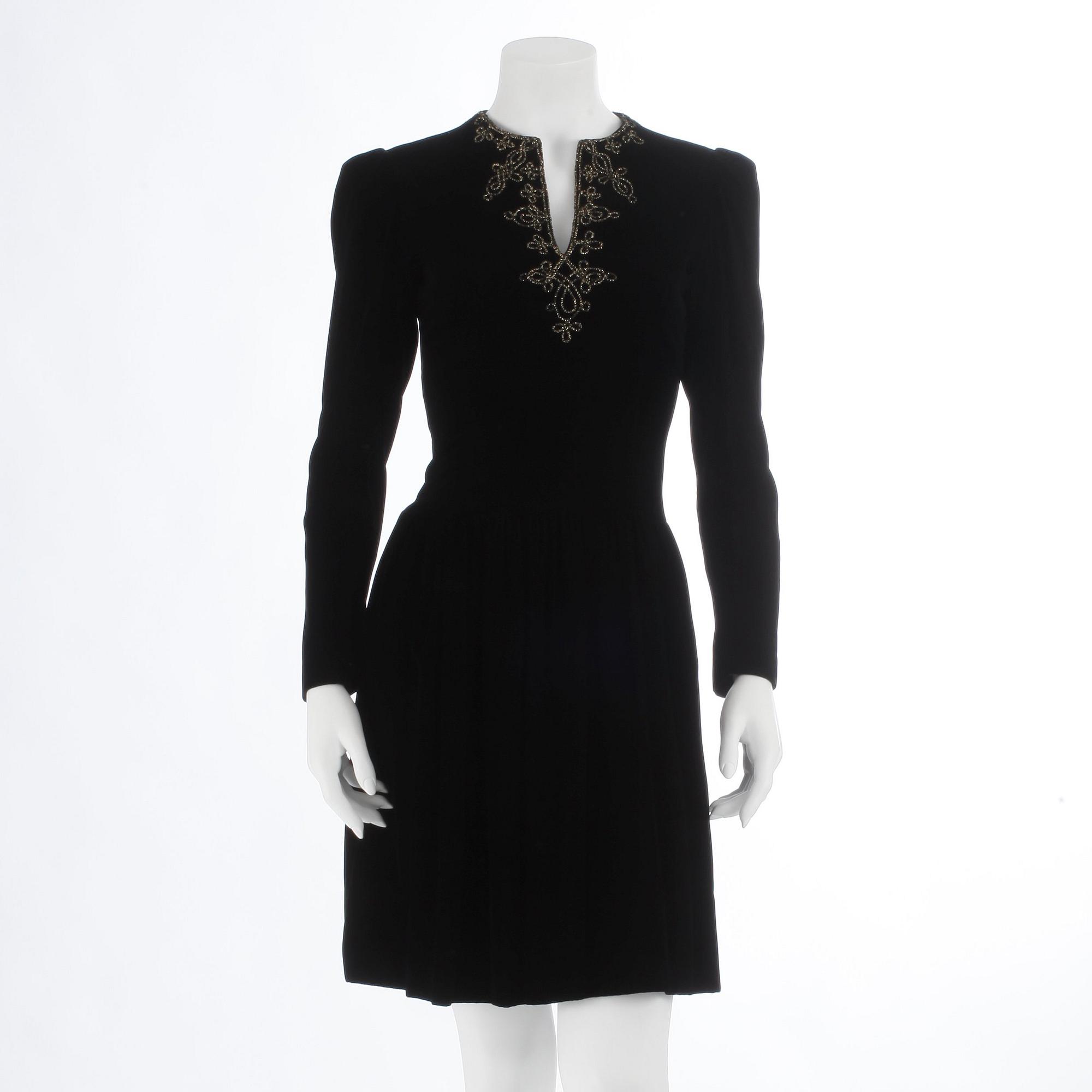 OSCAR DE LA RENTA, a black velvet dress with beading.