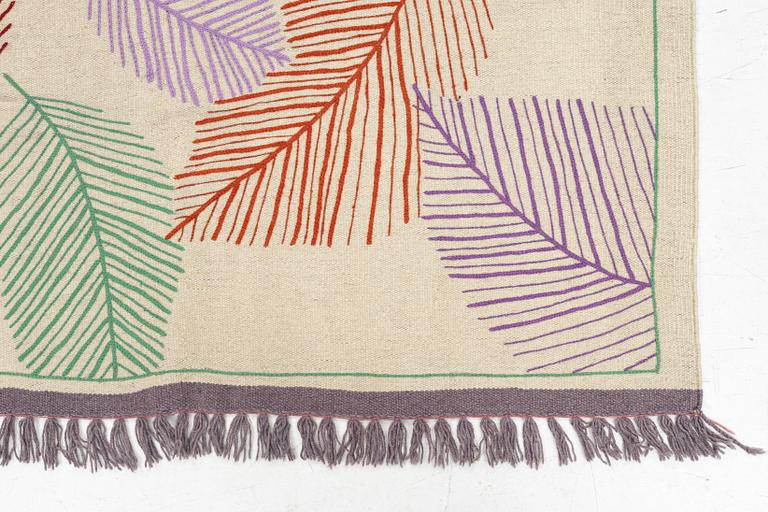A hand-embroidered Kilim rug, c. 199 x 145 cm.