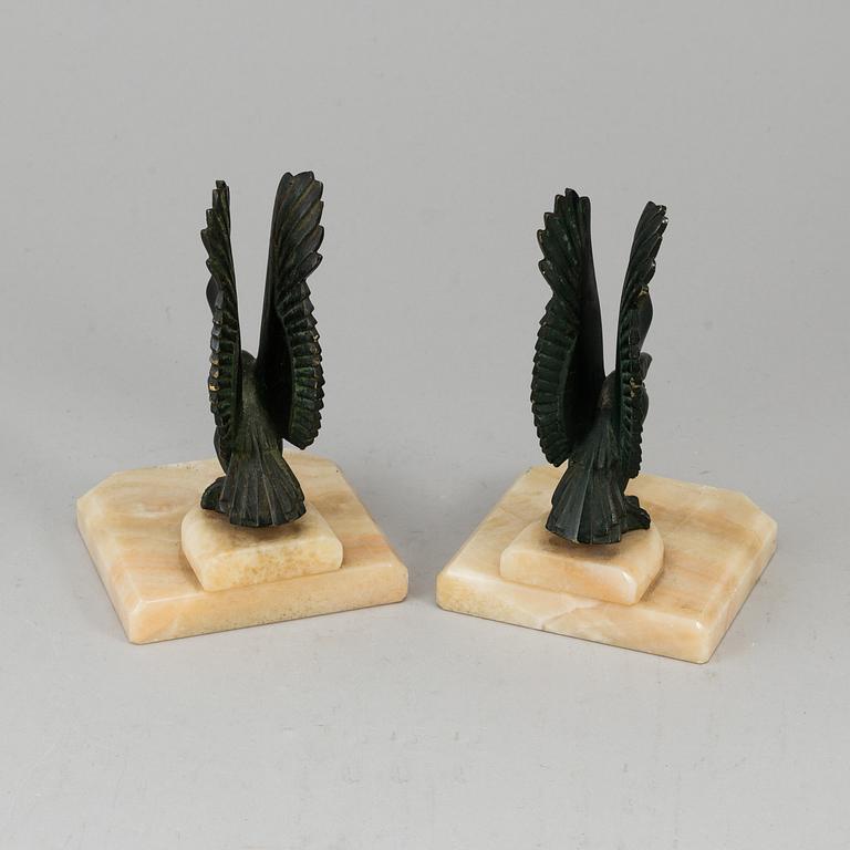 A pair of art déco marble and bronze book ends, 1930s.