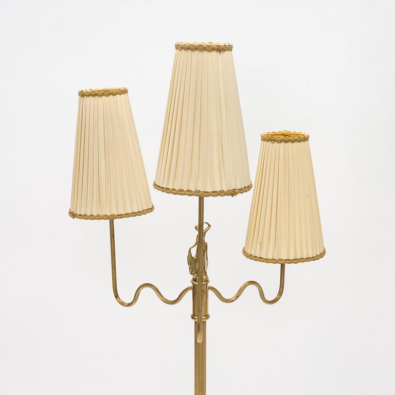 A Swedish Grace brass floor lamp, first part of the 20th Century.