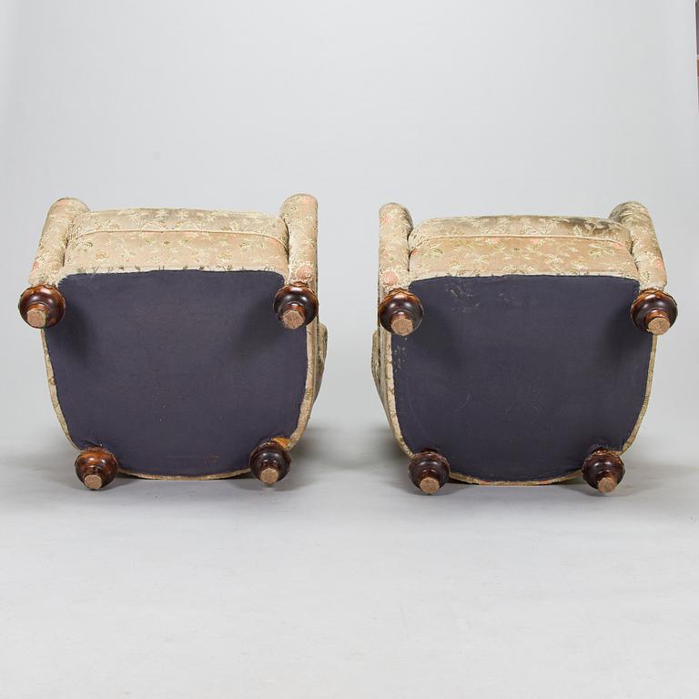 A pair of mid-20th-century armchairs.