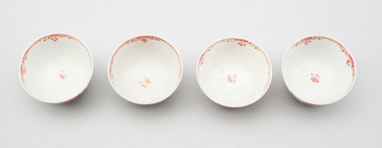 Set of three famille rose cups and saucers and a spare cup, 18th century.