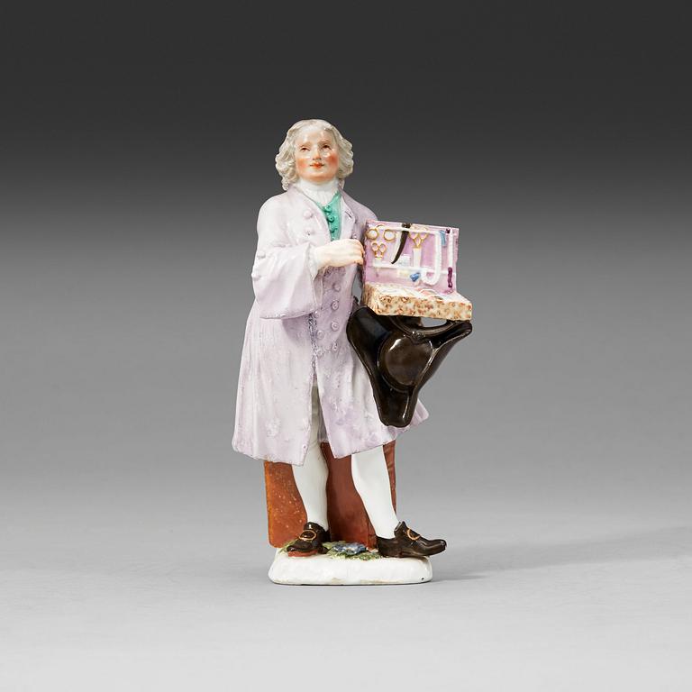 A Meissen porcelain figure of a trinket salesman from the series of Parisian street-traders, circa 1745.