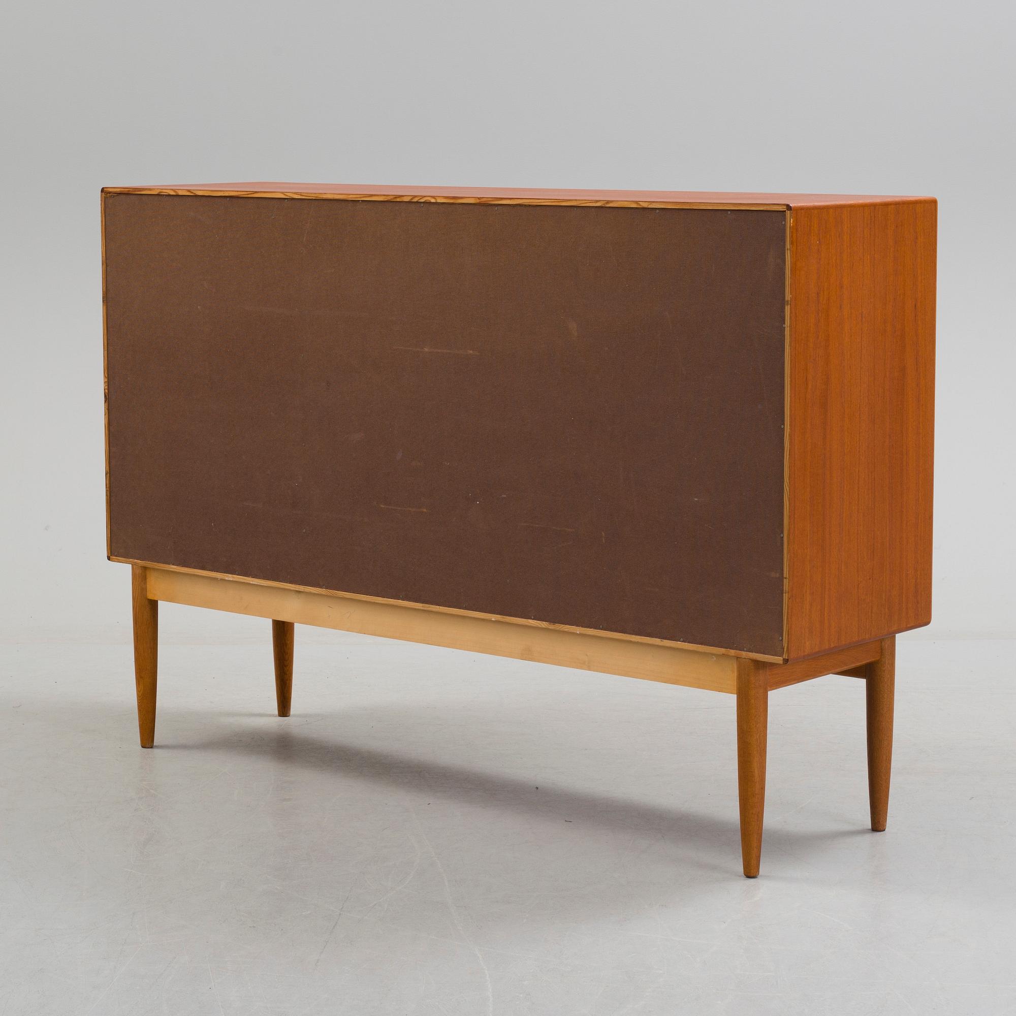 A second half of the 20th century teak veneered sideboard by Bertil Fridhagen, Bodafors, Sweden.