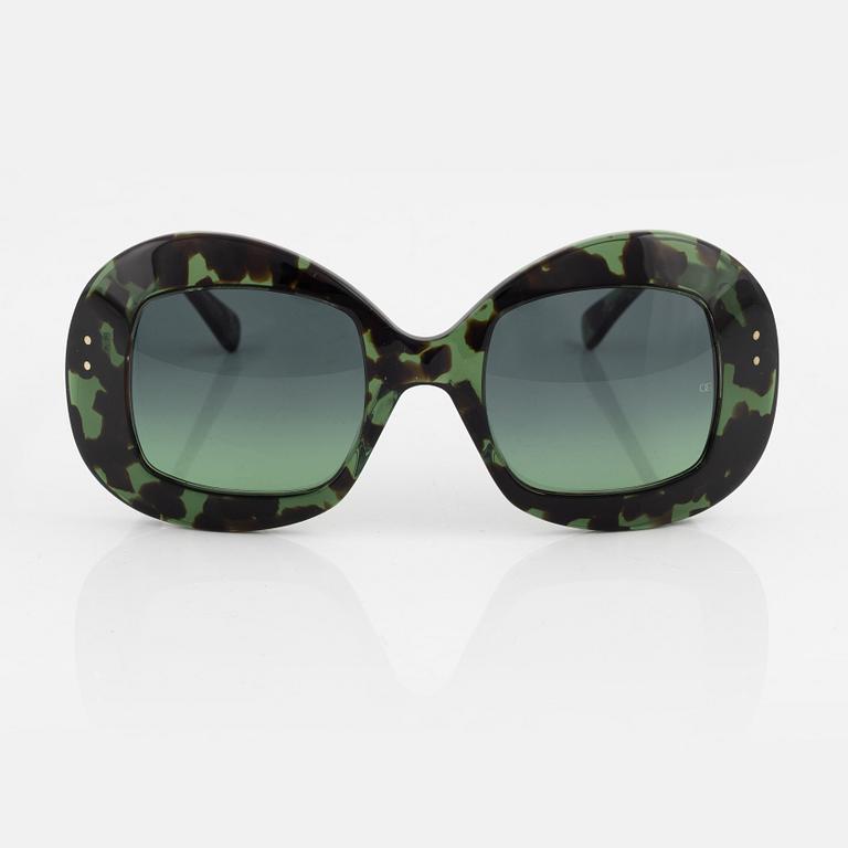 Oliver Goldsmith, a pair of green "Uuksu" sunglasses.