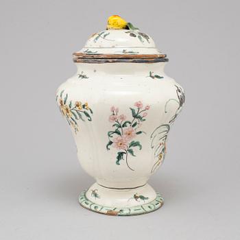 A 20th century urn and lid.