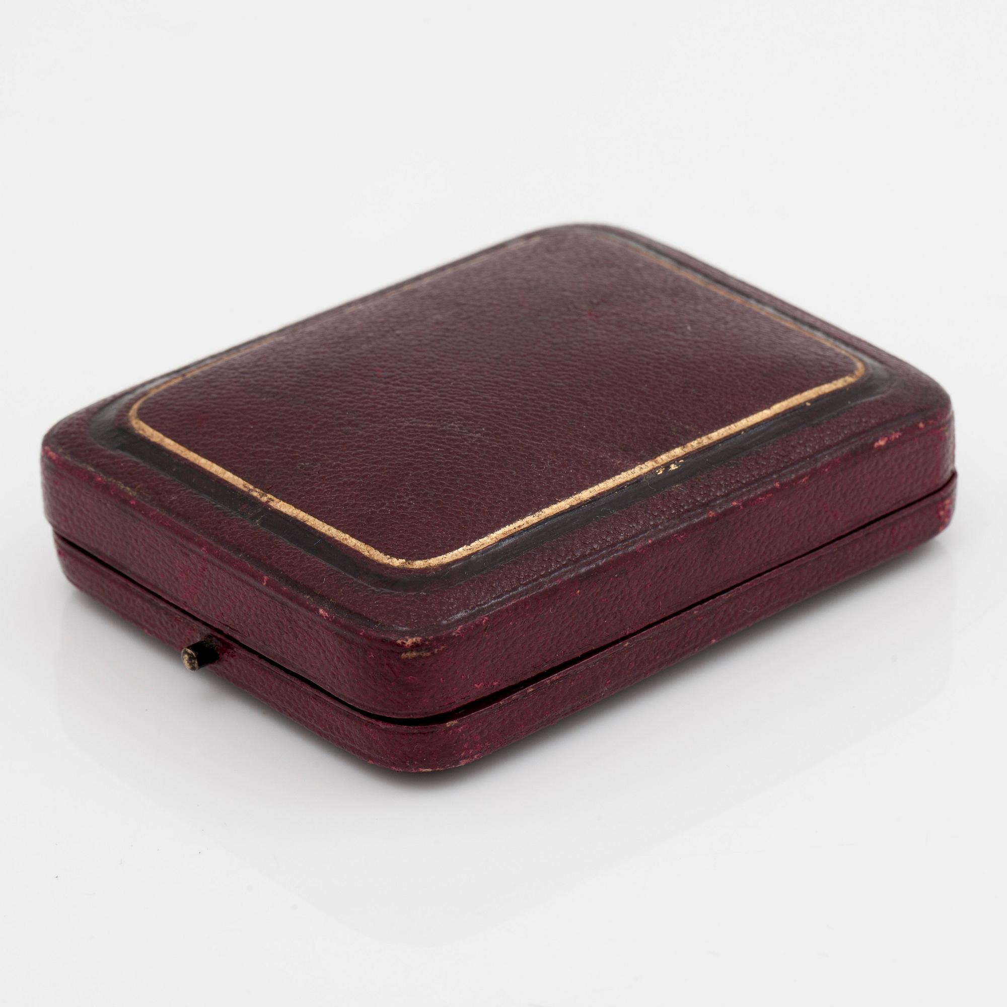 A ladies watch that can be worn as a brooch. Enamel set with diamonds. Cylinder escapement. Circa 1890-1900.