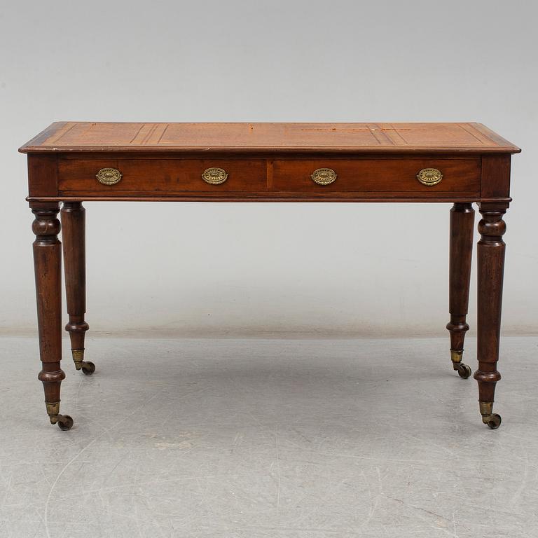 A late 19th century English writing table signed Holland & Sons.