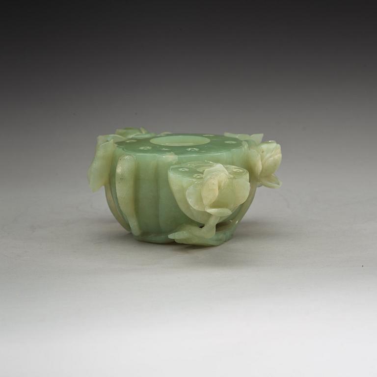 A Chinese lotusshaped serpentine stone brush washer.