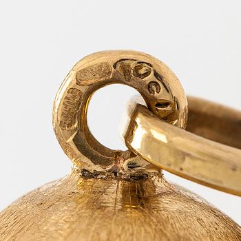 Kaulakoru, 14K ja 18K kultaa, tupsuriipuksella. Sveitsi ja Italia.