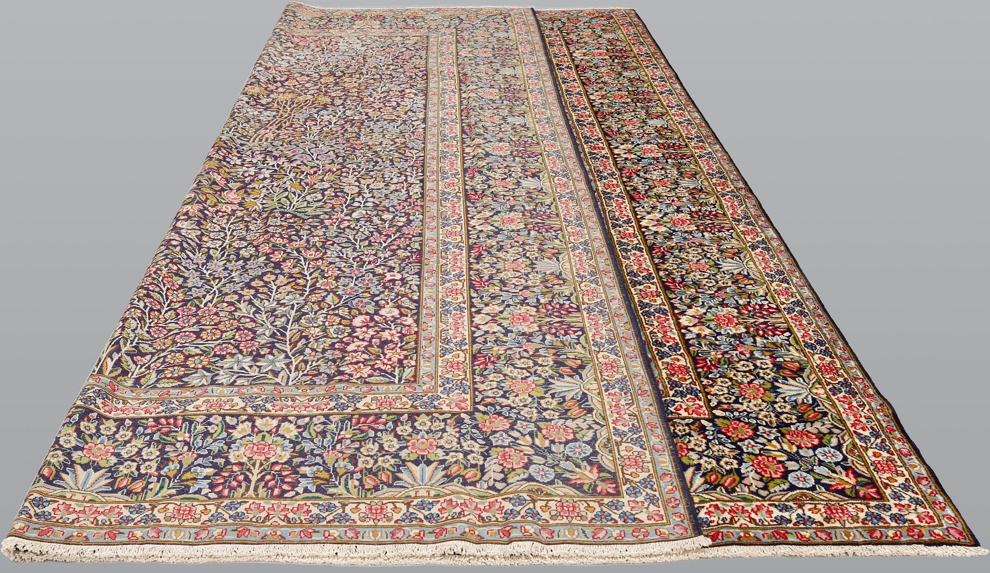 A Kirman Laver carpet, 'Millefleur', approx. 400 x 295 cm.