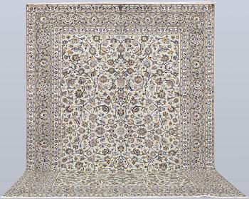 A Keshan carpet, signed, 397 x 302 cm.