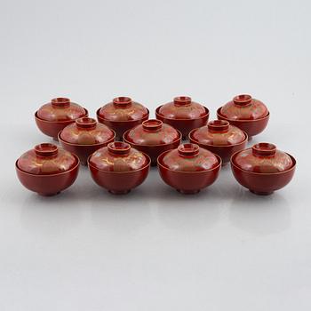 Eleven lacquer-ware bowls with lids, Japan, first half/mid 20th century.