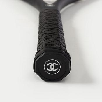 Chanel, tennis racket and 4 balls with case.