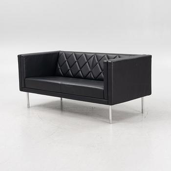 A leather upholstered sofa, 21st Century.