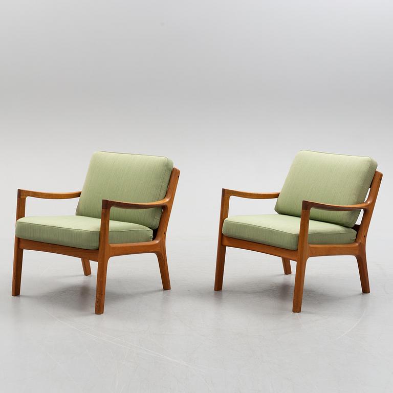 A pair of Ole Wanscher 'Senator' teak easy chairs, for France & Son, Denmark, second half of the 20th century.