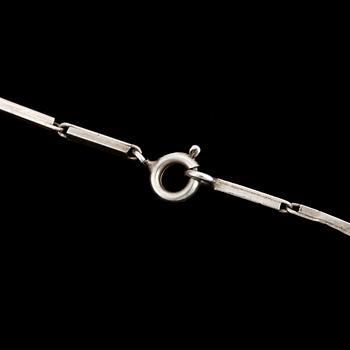 A glass pendant designed by Gunnar Cyrén and a silver necklace.