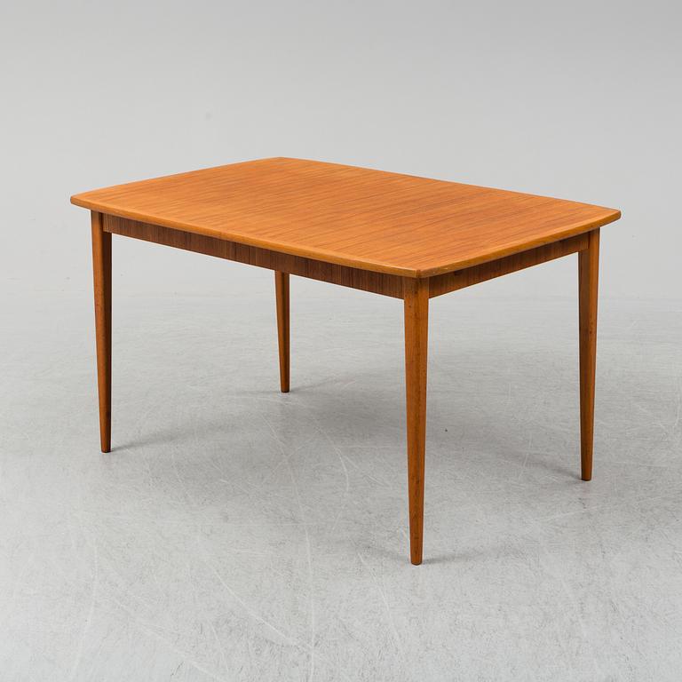 A second half of the 20th century teak veneered dining table.