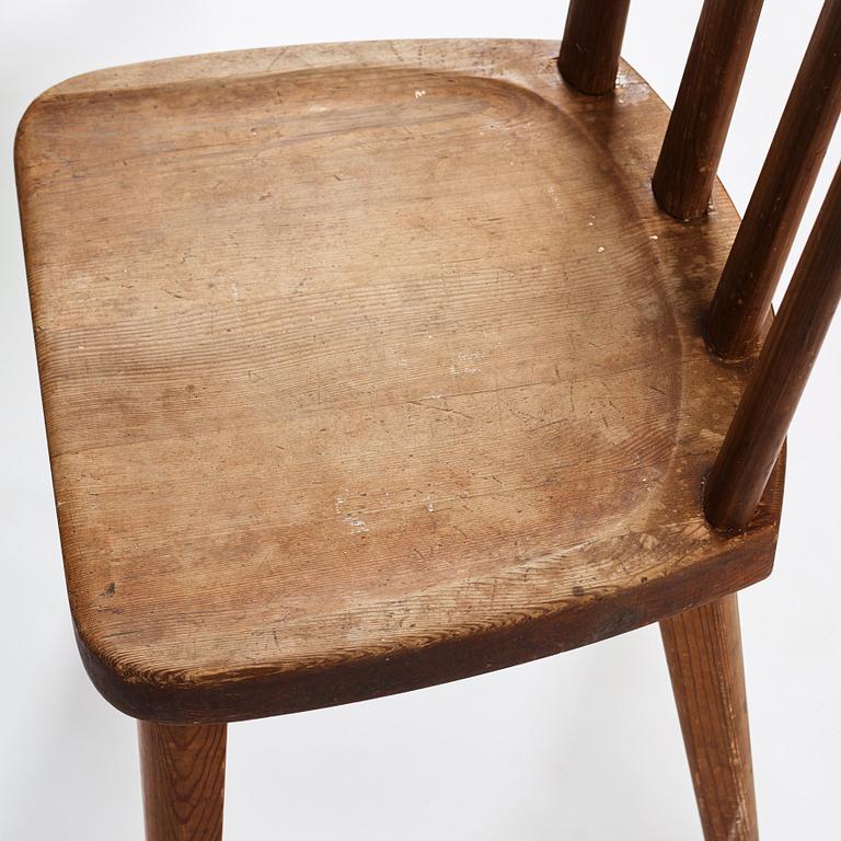 Axel Einar Hjorth, a set of four stained pine "Utö" chairs, Nordiska Kompaniet, Sweden 1930s.