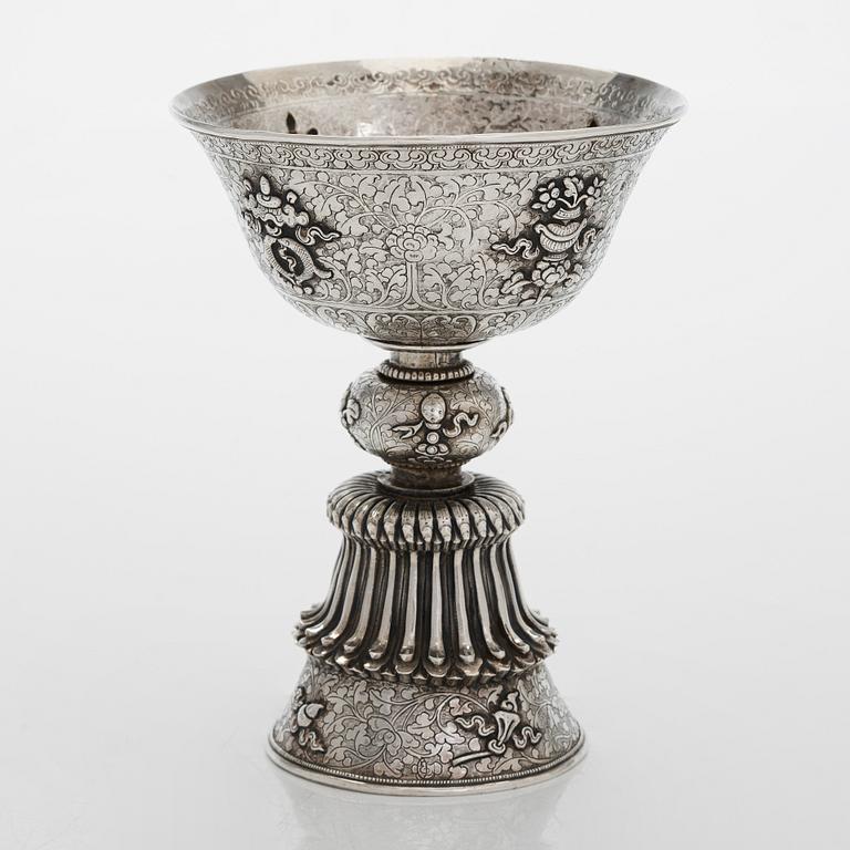 A Tibetan butter lamp, silver, early 19th century.