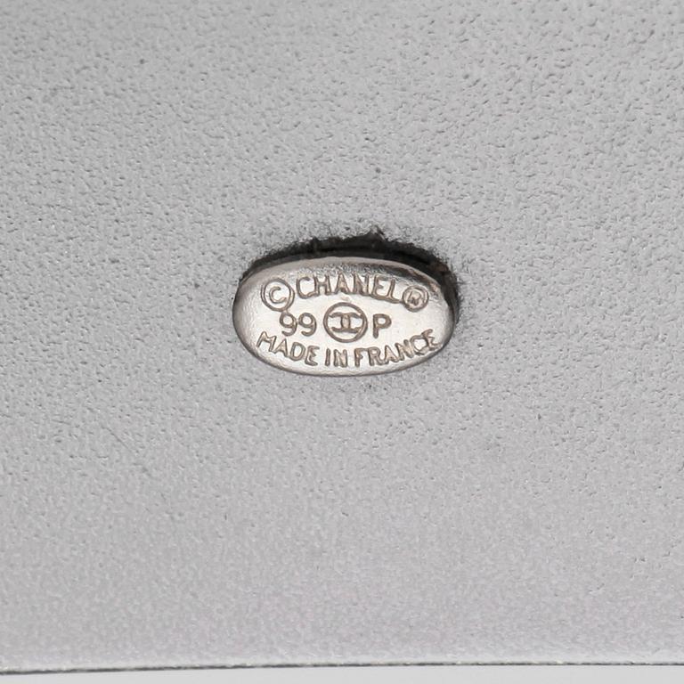 CHANEL, a black leather belt.