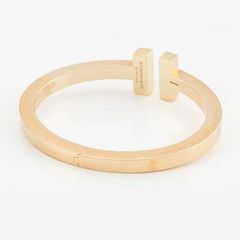 Tiffany & Co armband "Tiffany T" 18K guld med runda briljantslipade diamanter.