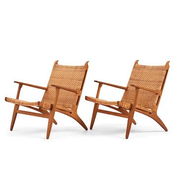 398. Hans J. Wegner, a pair of oak easy chairs 'CH27', Carl Hansen & Son, Denmark, 1950s.