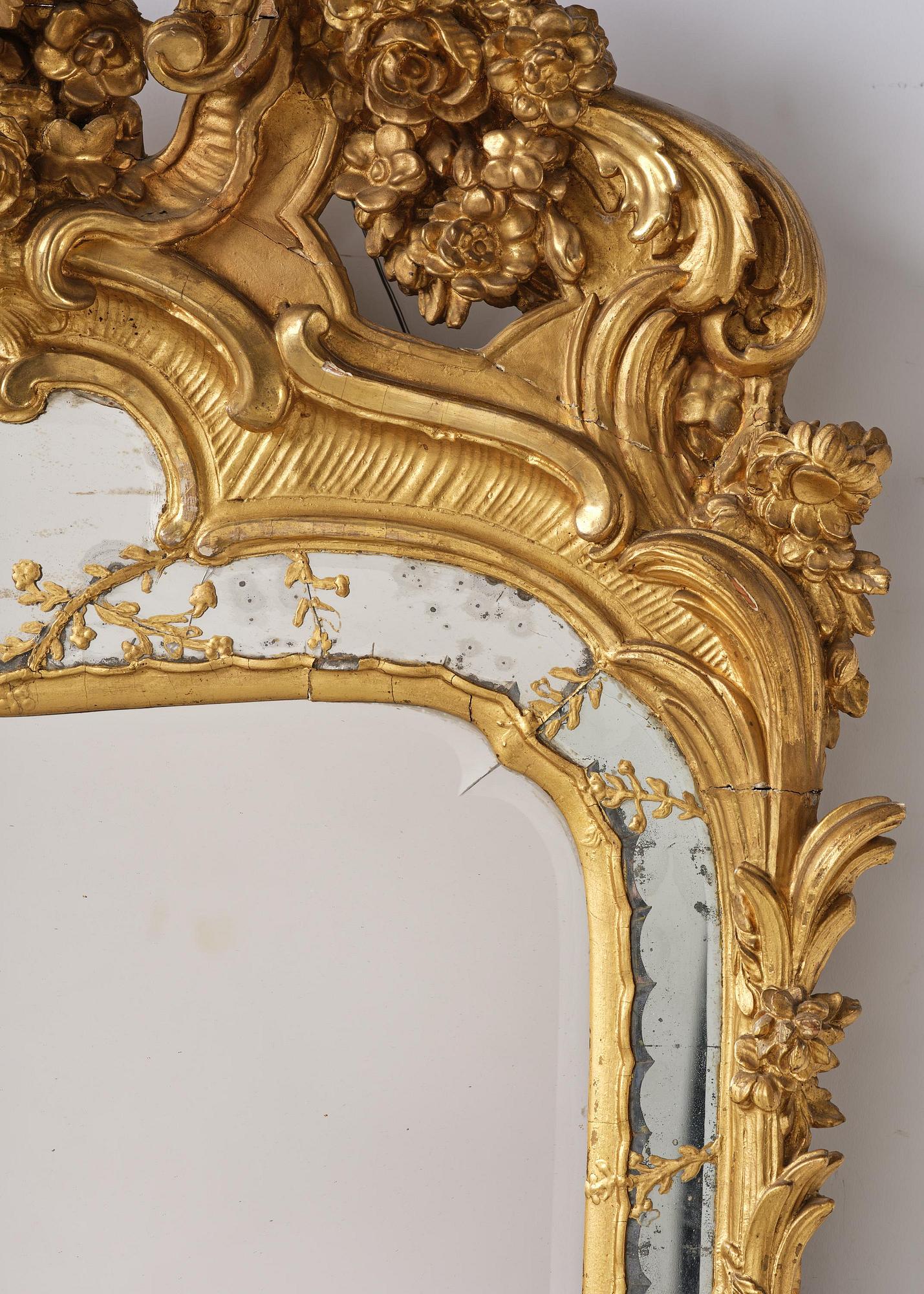 A giltwood rococo mirror, Stockholm, later part 18th century.
