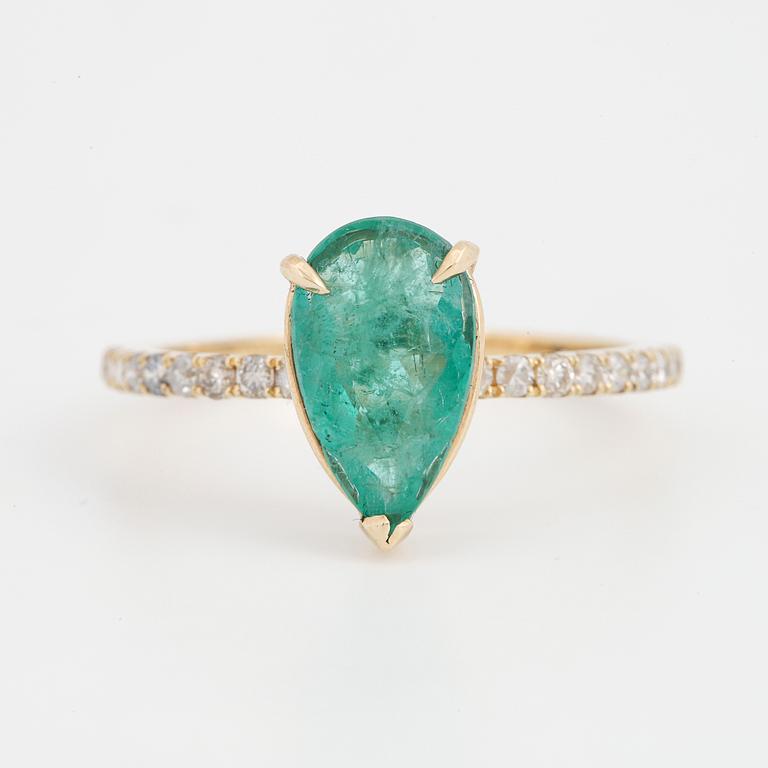 Pear shaped emerald and brilliant-cut diamond ring.