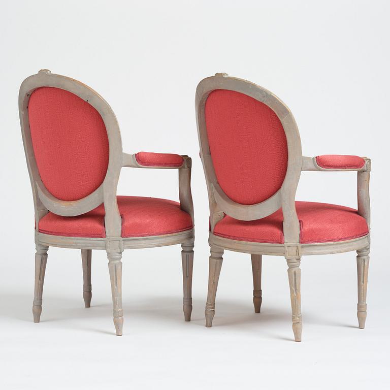 A pair of gustavian armchairs by J E Öhrmark.