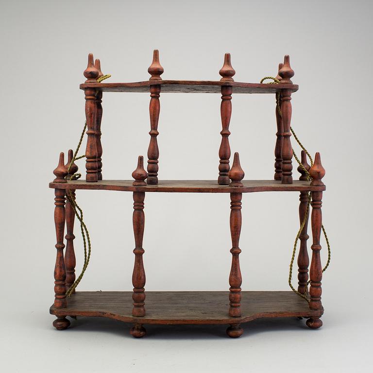 A painted folk art shelf for prayer books 19th century.