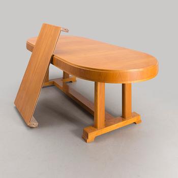 A mid 20th century dining table.