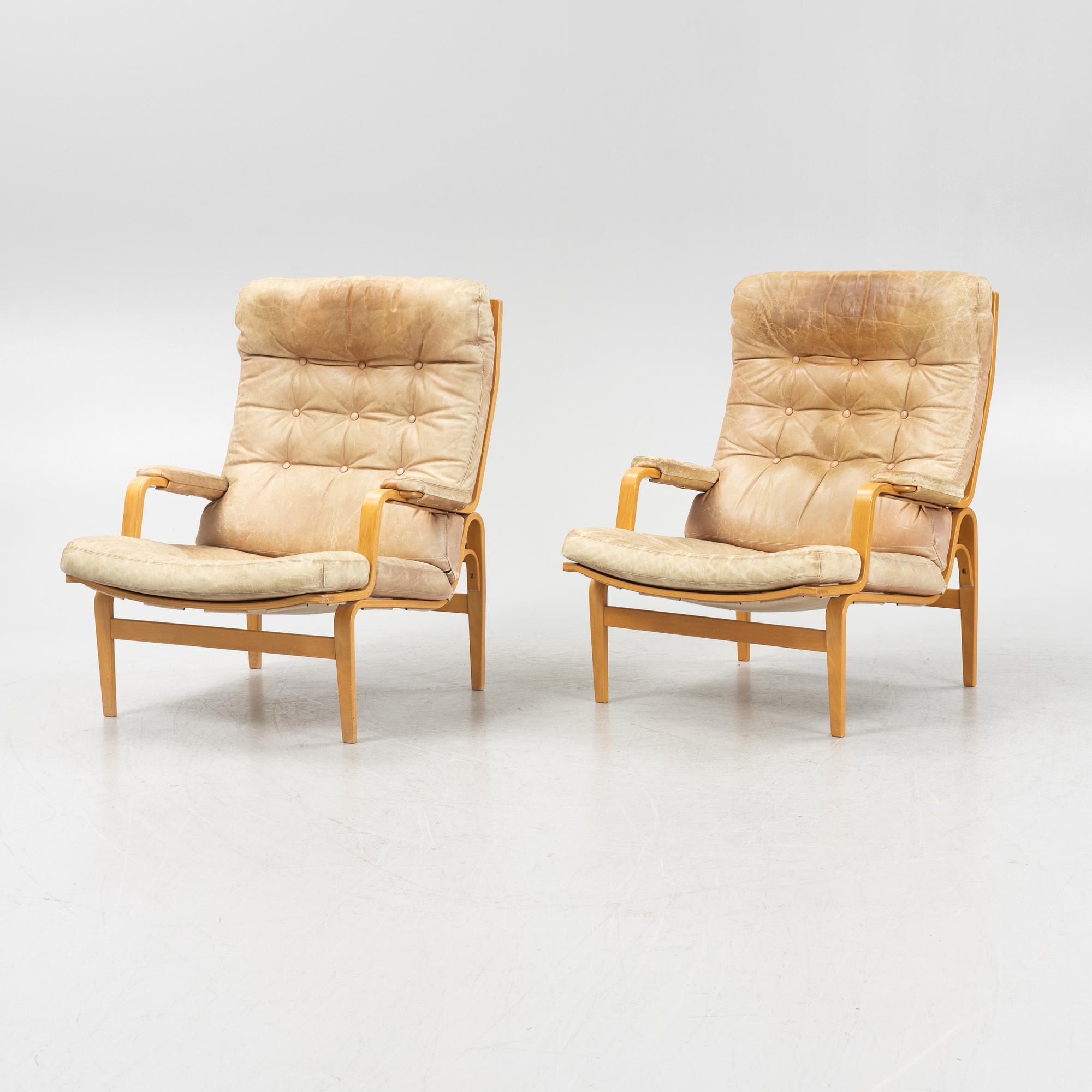 Bruno Mathsson, a pair of 'Ingrid' armchairs, Dux, Sweden, second half of the 20th century.