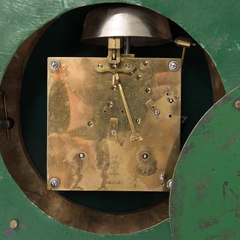 A wall clock in gustavian style, marked Rob. Engström, Stockholm.