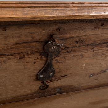 A 18th century baroque oak chest with iron mountings.