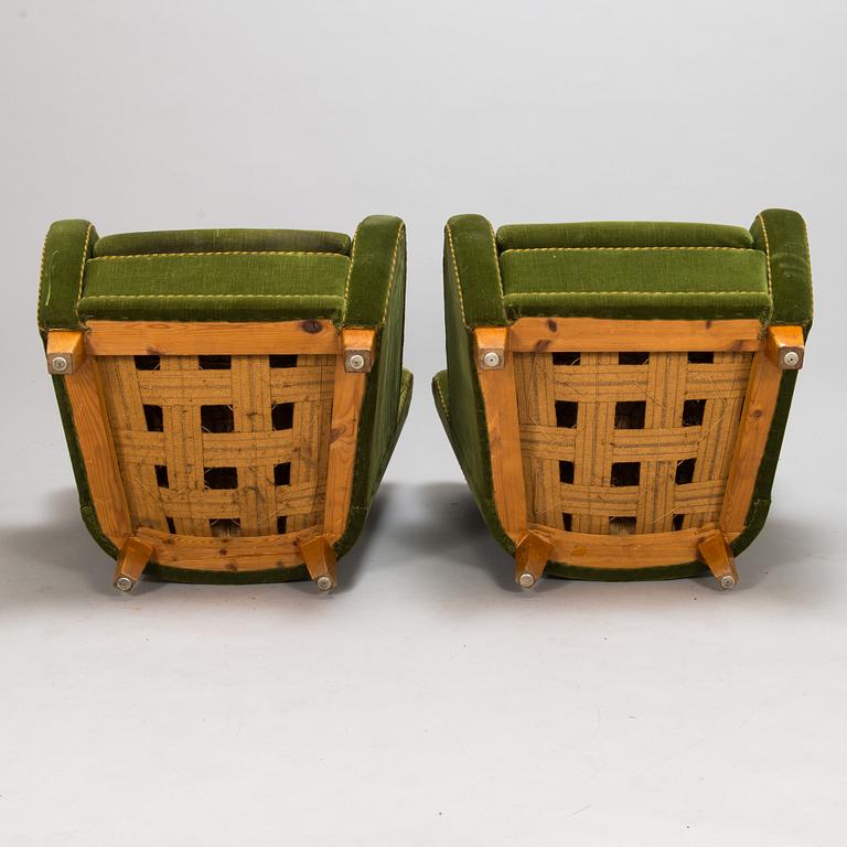 A pair of 1950s armchairs.